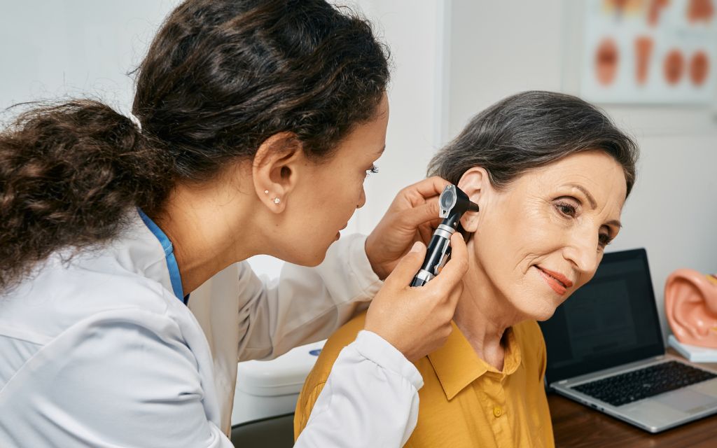 Senior woman having a hearing assessment